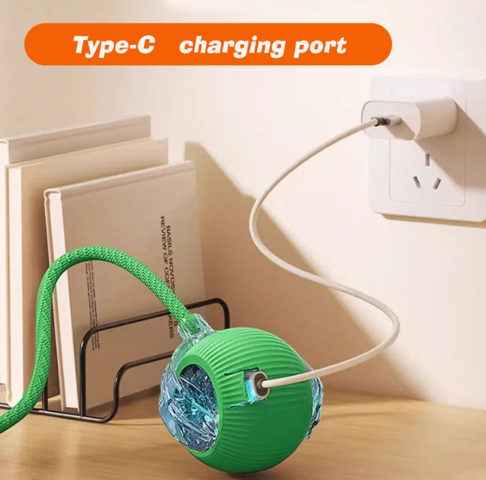 Green and blue ball-shaped device with a Type-C charging port on a wooden surface.