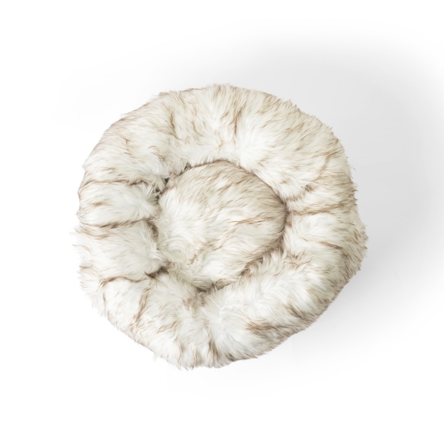 Round fur pet bed on a white background